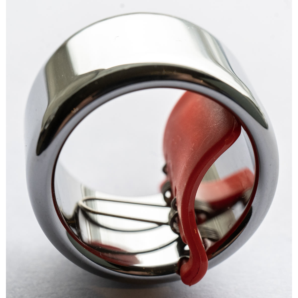 Close view of the current round Tungsten Slide Ring and its spring-loaded arm