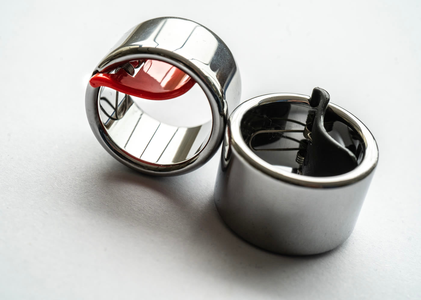 Current round Black Mountain Tungsten Slide Rings with red and black spring arms