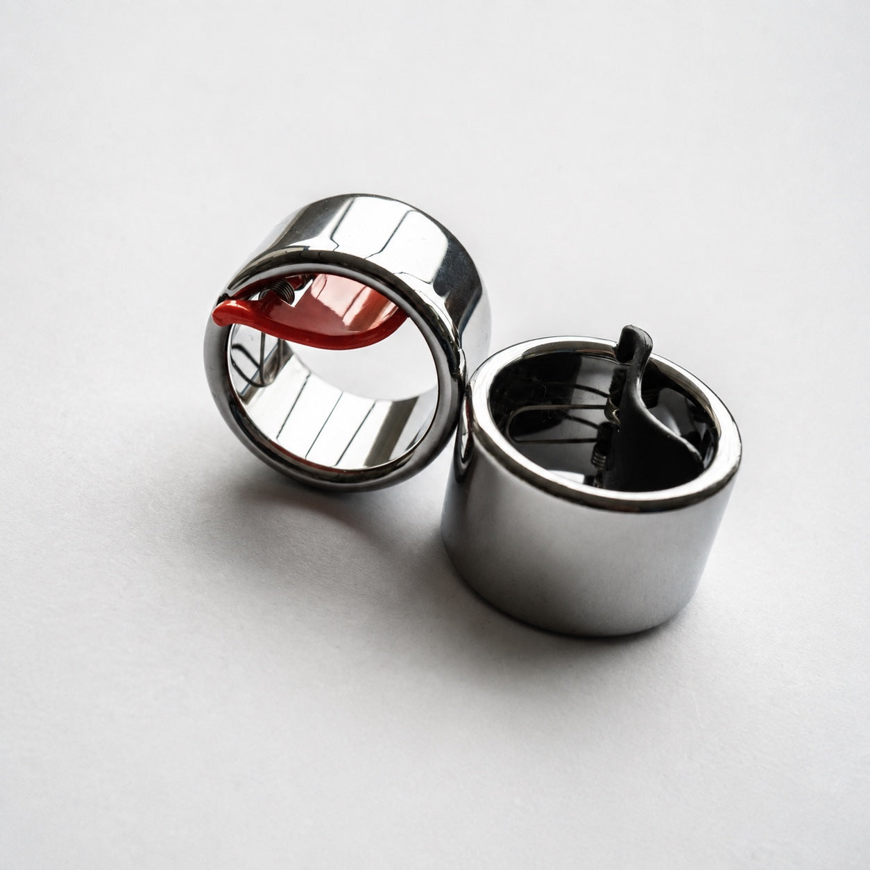 Current round Black Mountain Tungsten Slide Rings with red and black spring arms